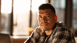 A Pascua Yaqui business owner discusses plans for a new enterprise in a modern office setting